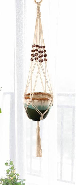 Suspension Macramé Mégane Atelier Macramé devant une fenêtre